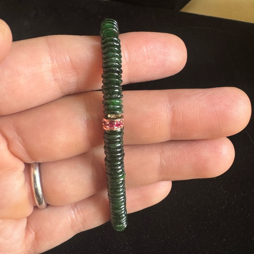 New Burmese Jade bracelet in green with a little cute accent in it.